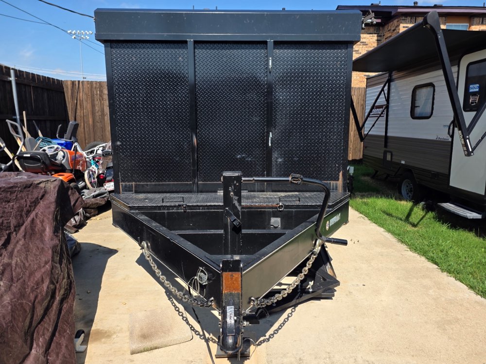 Front view of the 16ft Silverback Rental dump trailer showing the hitch and tongue